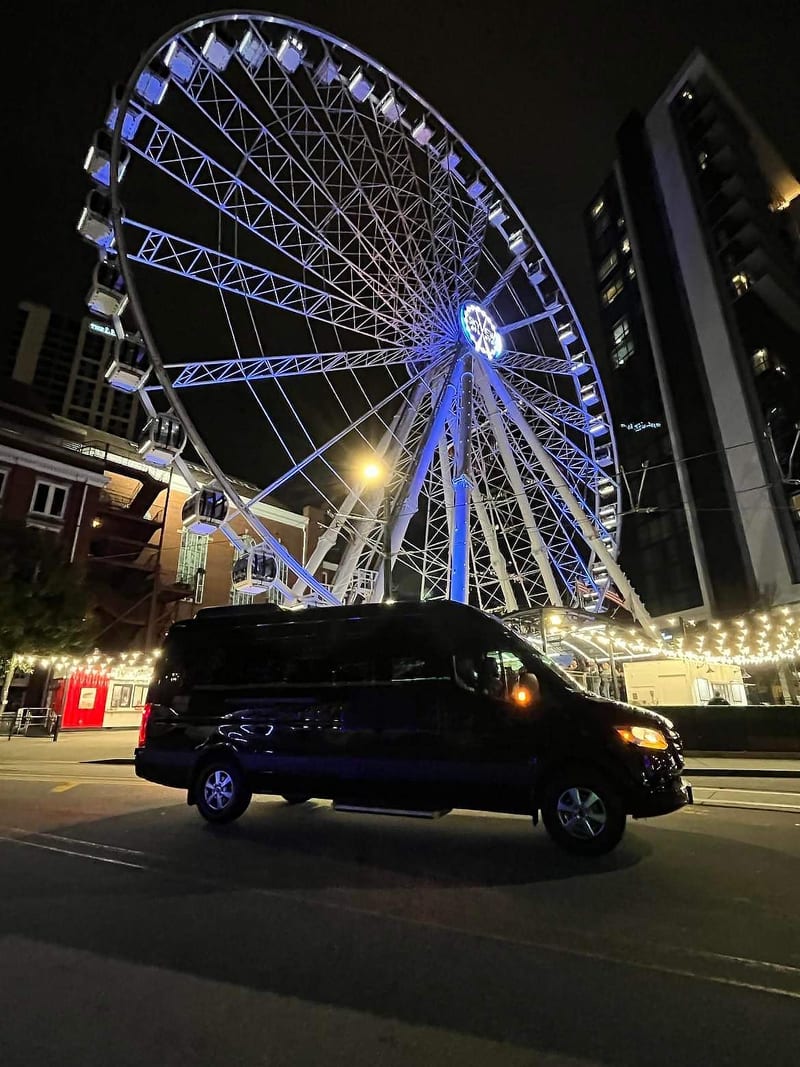 The Sprinter at night beneath the SkyView ferris wheel