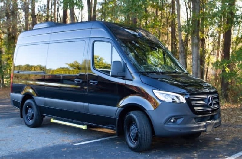Front three quarter view of the black Sprinter