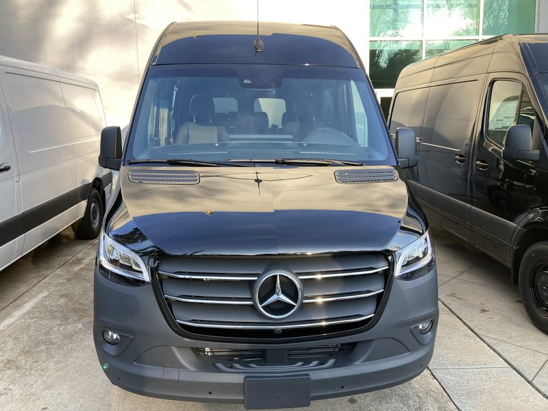 Front three quarter view of CE1, a black Mercedes-Benz Sprinter
