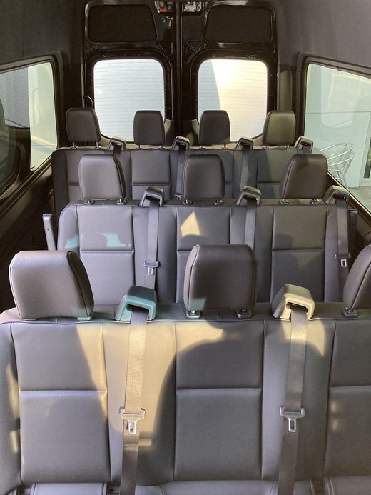 Leather passenger seating inside CE1, looking down the aisle