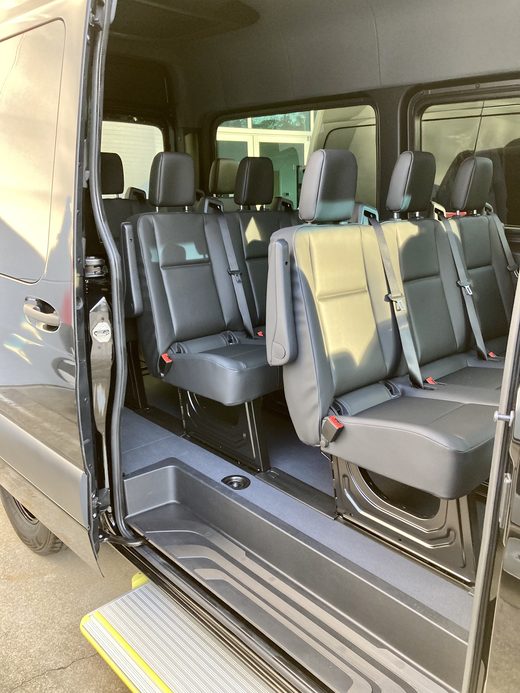 CE1 with the side door open and the step down
