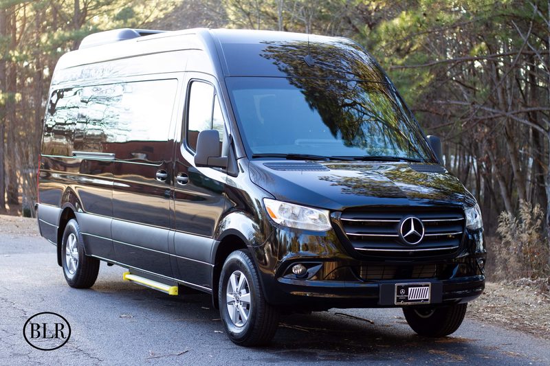 Front three quarter view of CE2, a black Mercedes-Benz Sprinter