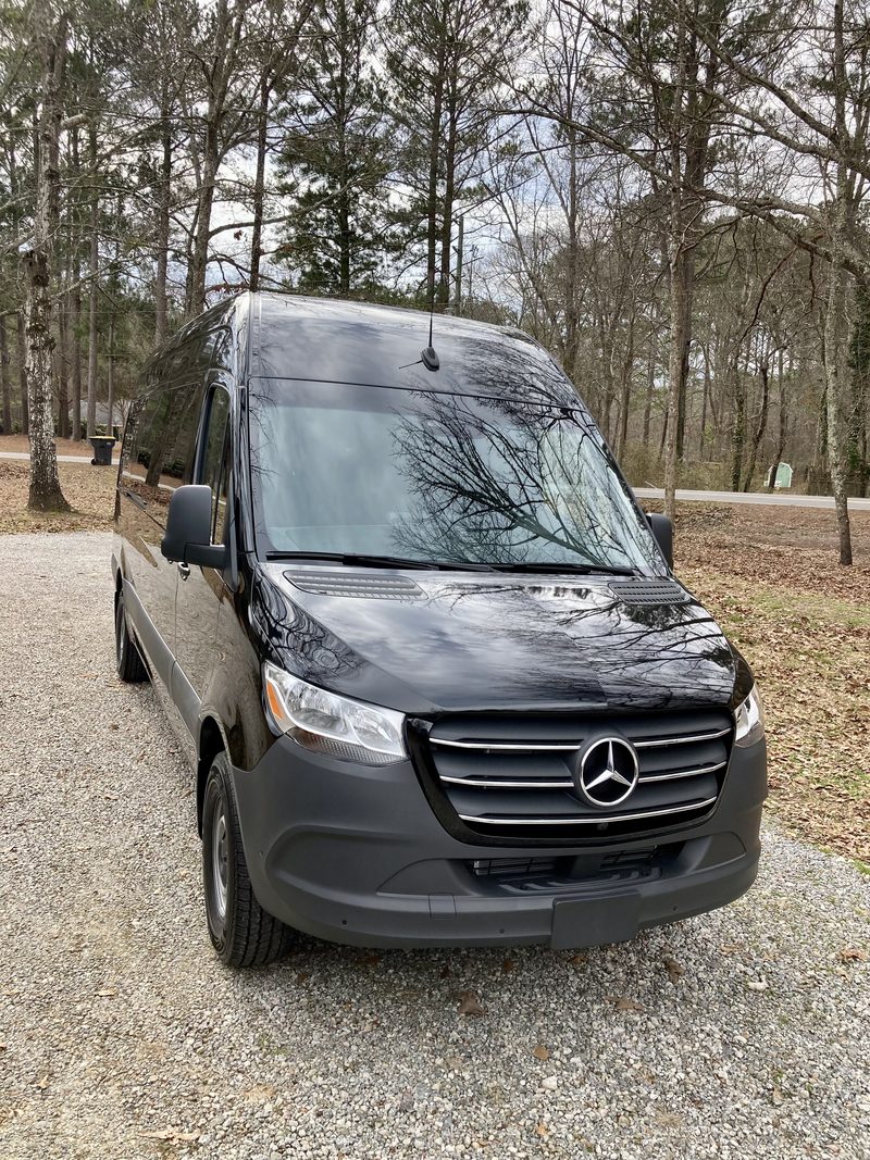 Front three quarter view of CE3, a black Mercedes-Benz Sprinter