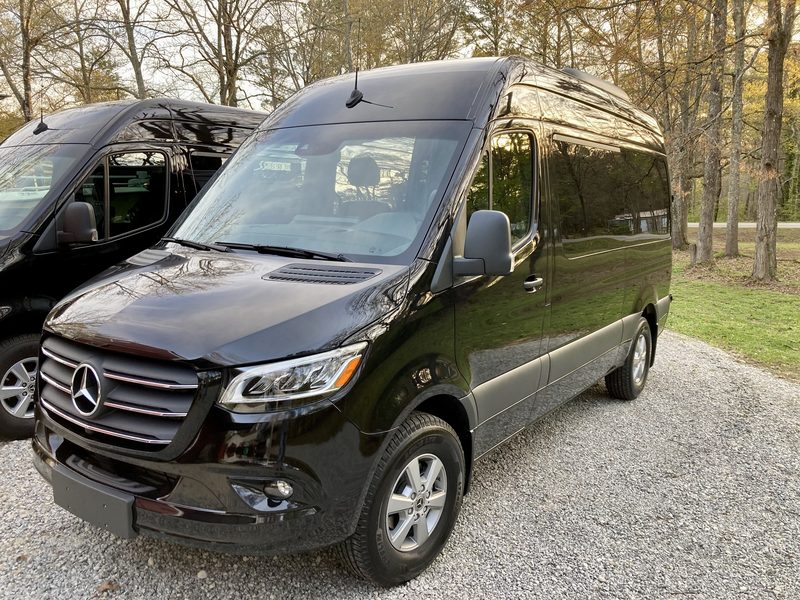 Front three quarter view of CE4, a black Mercedes-Benz Sprinter