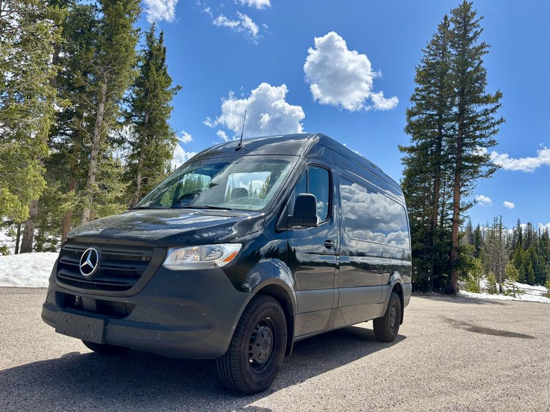 Front three quarter view of CE5, a black Mercedes-Benz Sprinter