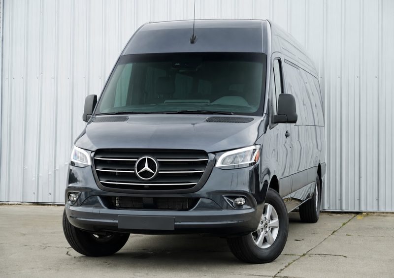 Front three quarter view of CE6, a charcoal gray Mercedes-Benz Sprinter